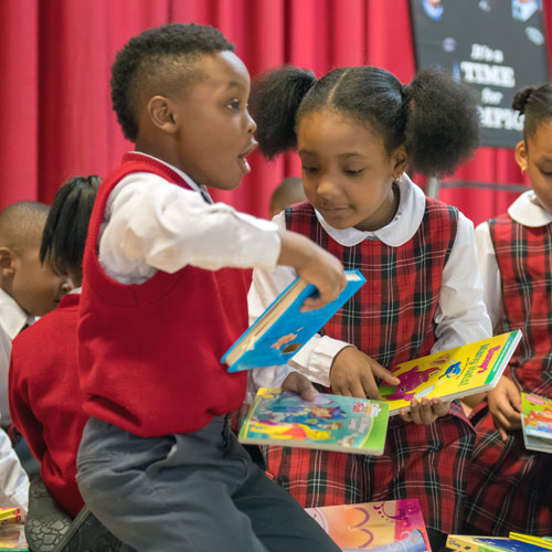 Kelly Cares Donates 10,000 Books to New York City Catholic Schools